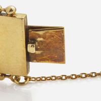 An Antique Yellow Gold Bangle Bracelet with Applique Charms