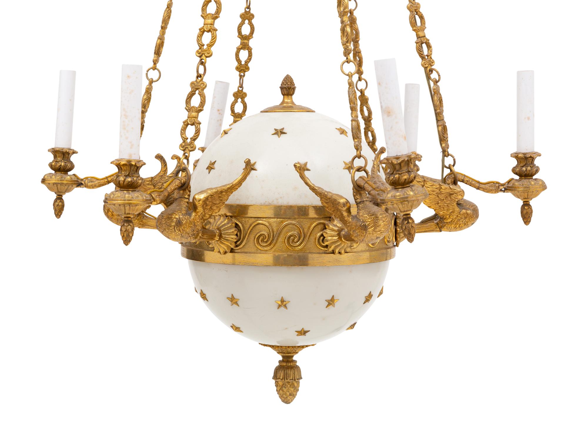 An Empire Style Gilt Bronze and Tole Six-Light Chandelier