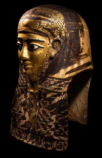 An Egyptian Gilt Cartonnage Mummy Mask