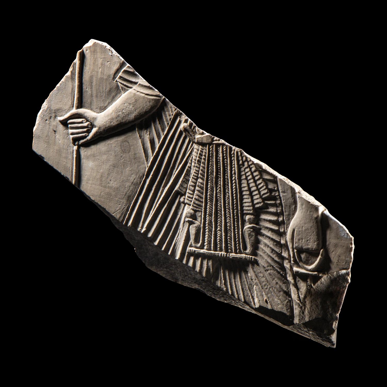 An Egyptian Limestone Relief Fragment with a Pharaoh
