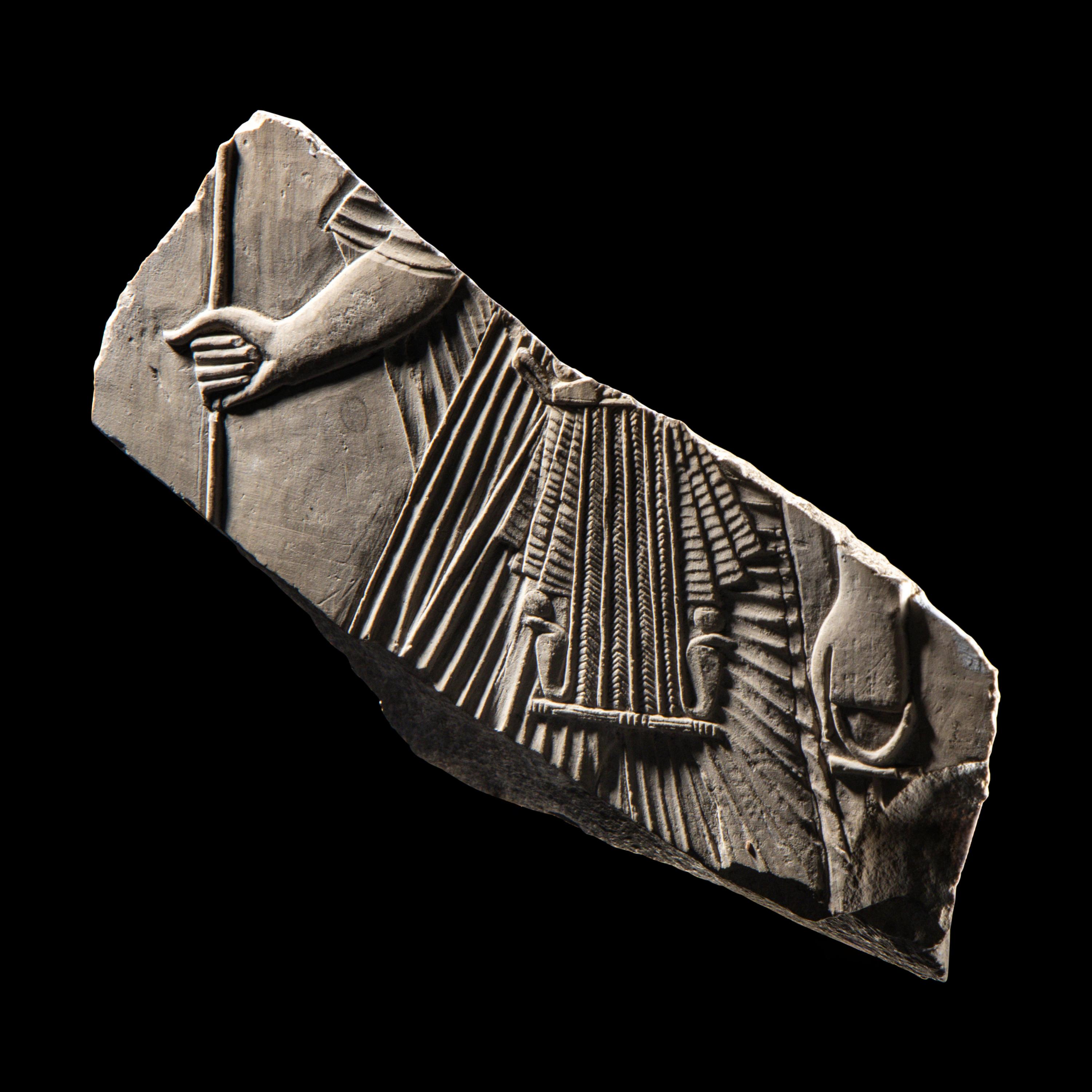 An Egyptian Limestone Relief Fragment with a Pharaoh