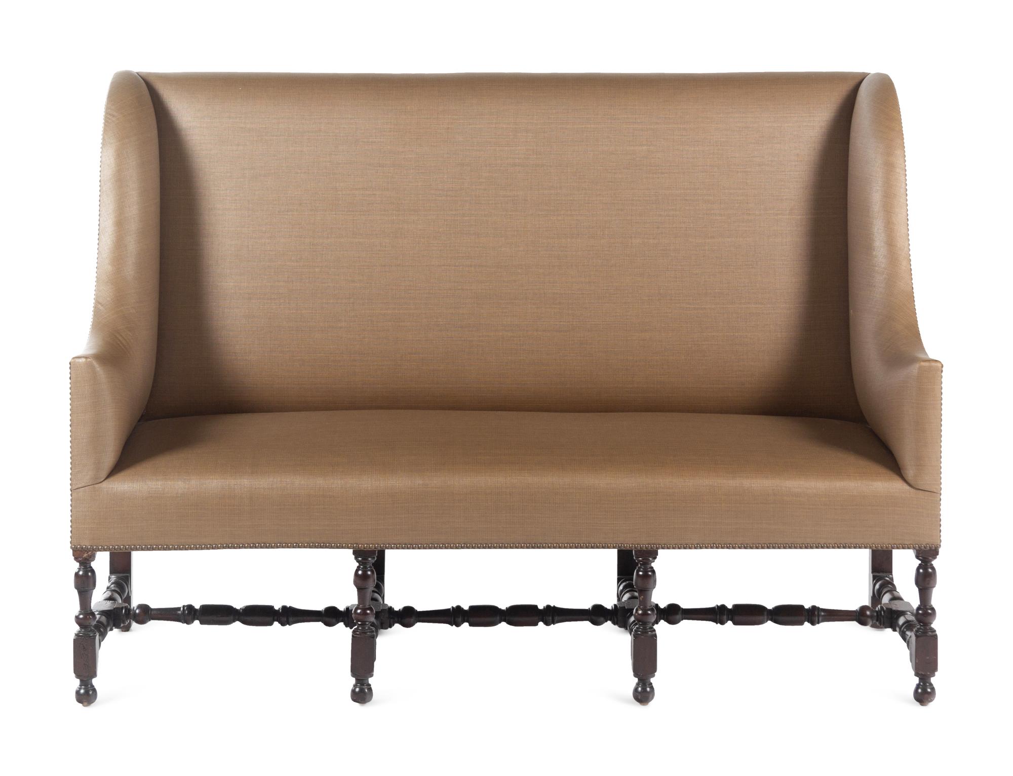 A French Walnut Wingback Sofa