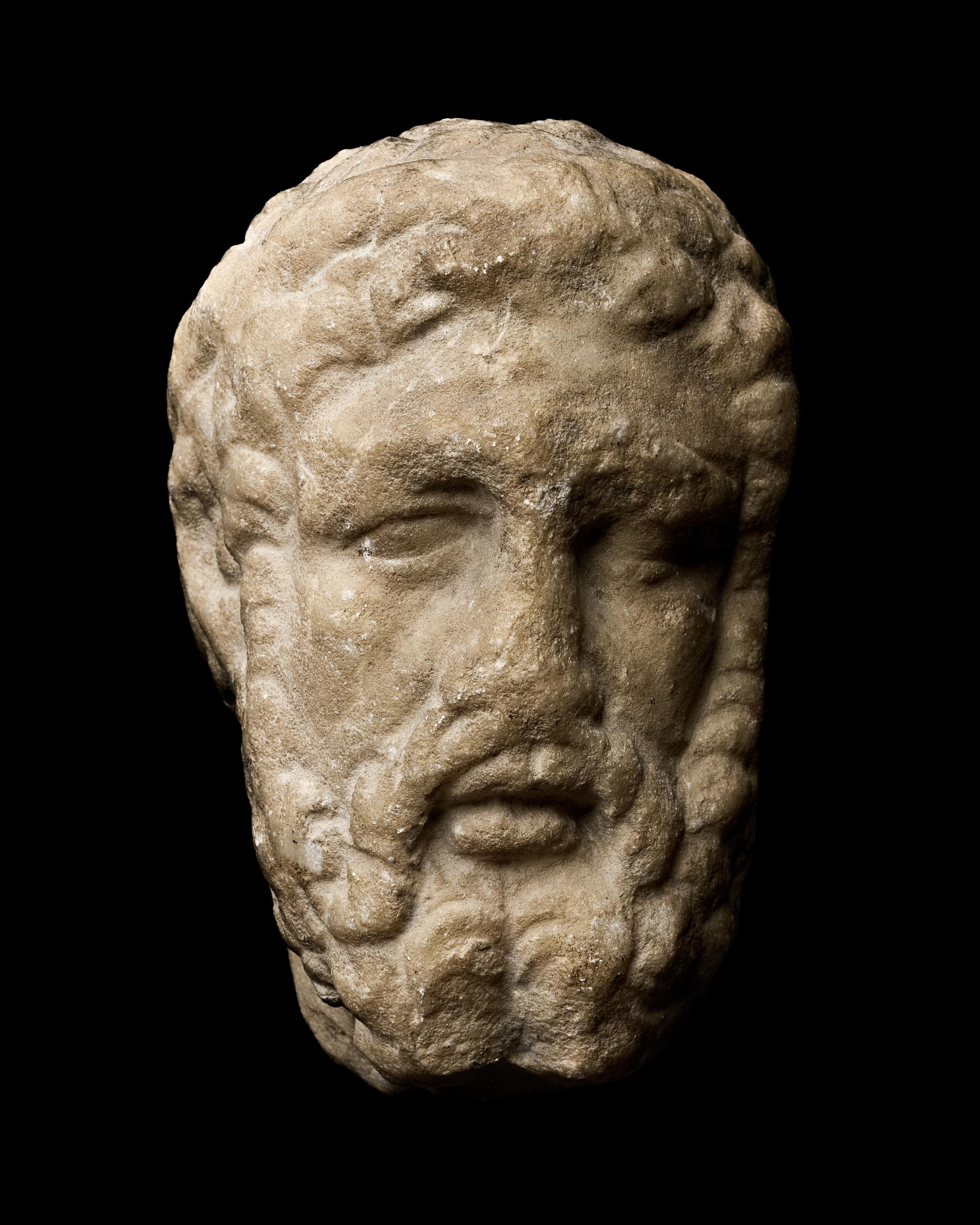 A Roman Marble Portrait Head of a Beaded Man