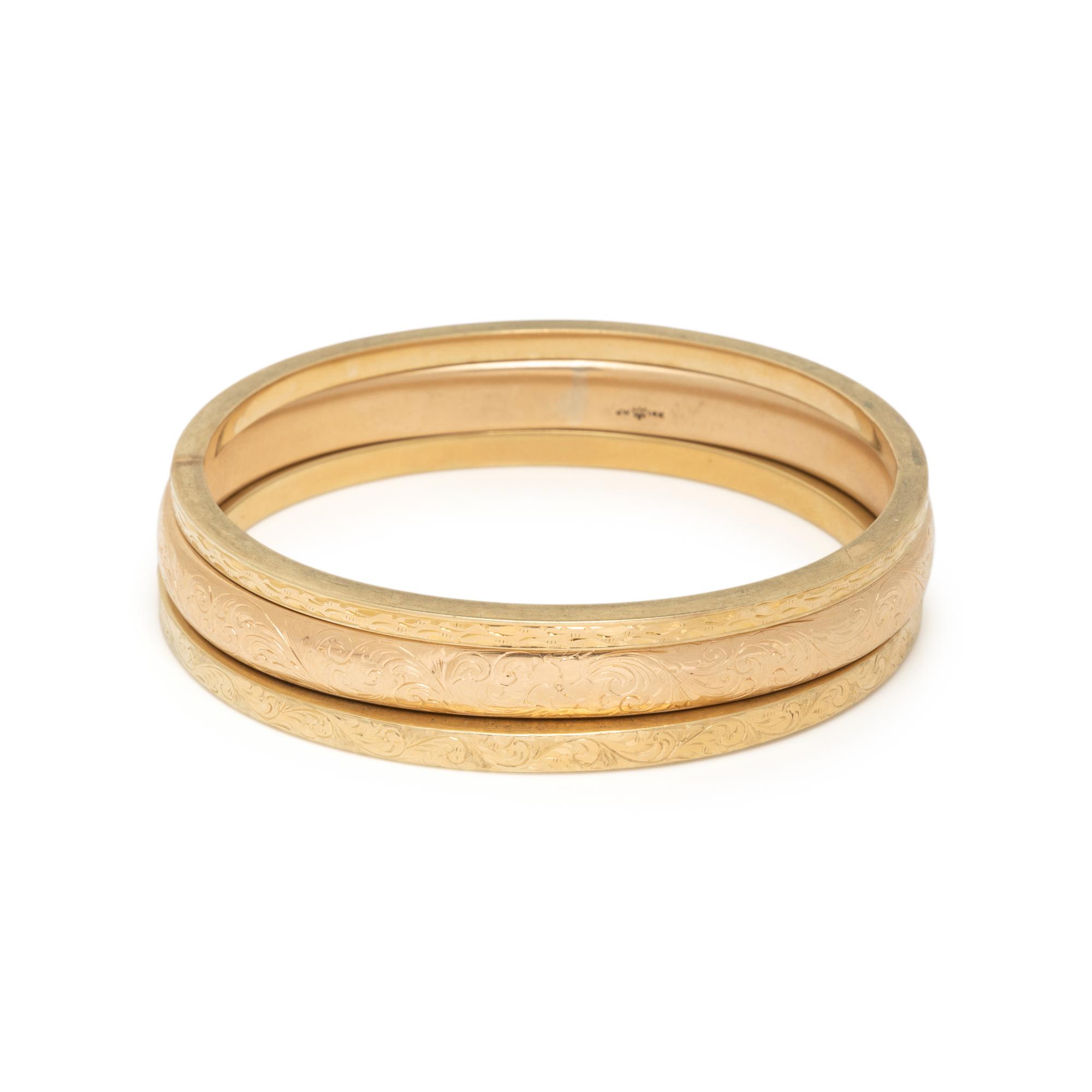 COLLECTION OF YELLOW GOLD BANGLE BRACELETS