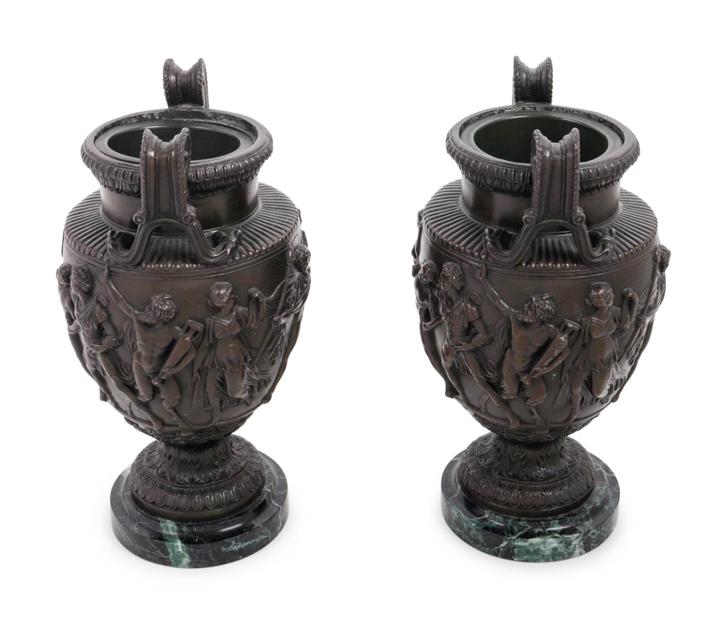 A Pair of Grand Tour Cast Metal and Marble Urns
