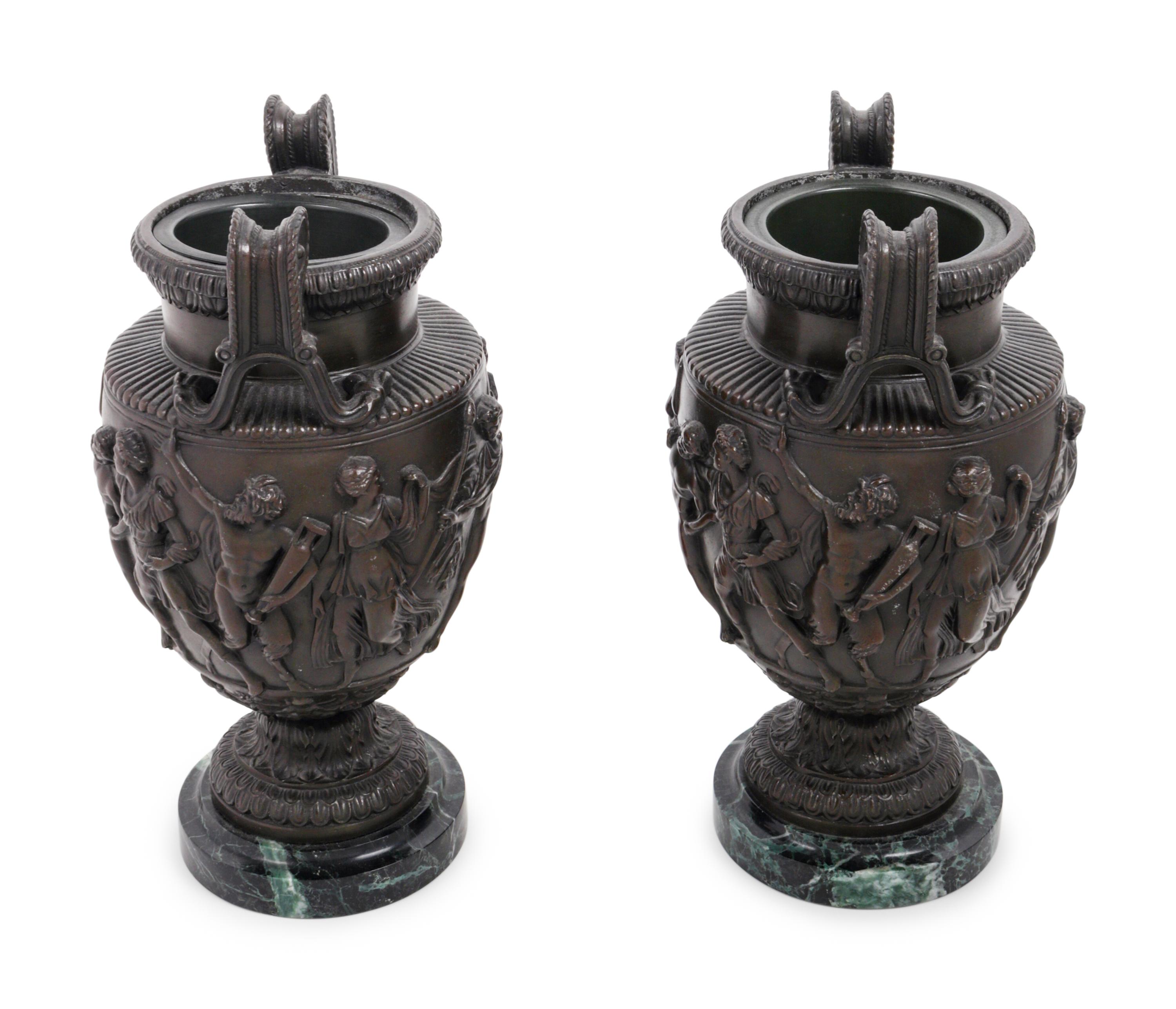 A Pair of Grand Tour Cast Metal and Marble Urns