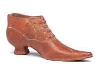 A Glazed Pottery Woman's High-Heeled Shoe
