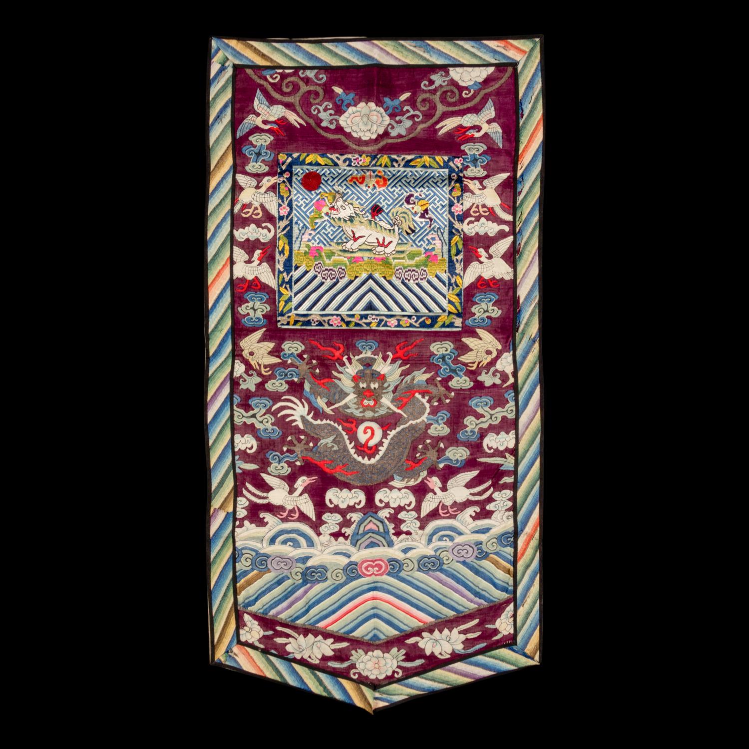 A Chinese Maroon Ground Embroidered and Kesi Silk 'Xiezhi' Rank Badge, Late 19th Century 清晚期 絳紅地緙絲納紗御史獬豸補子