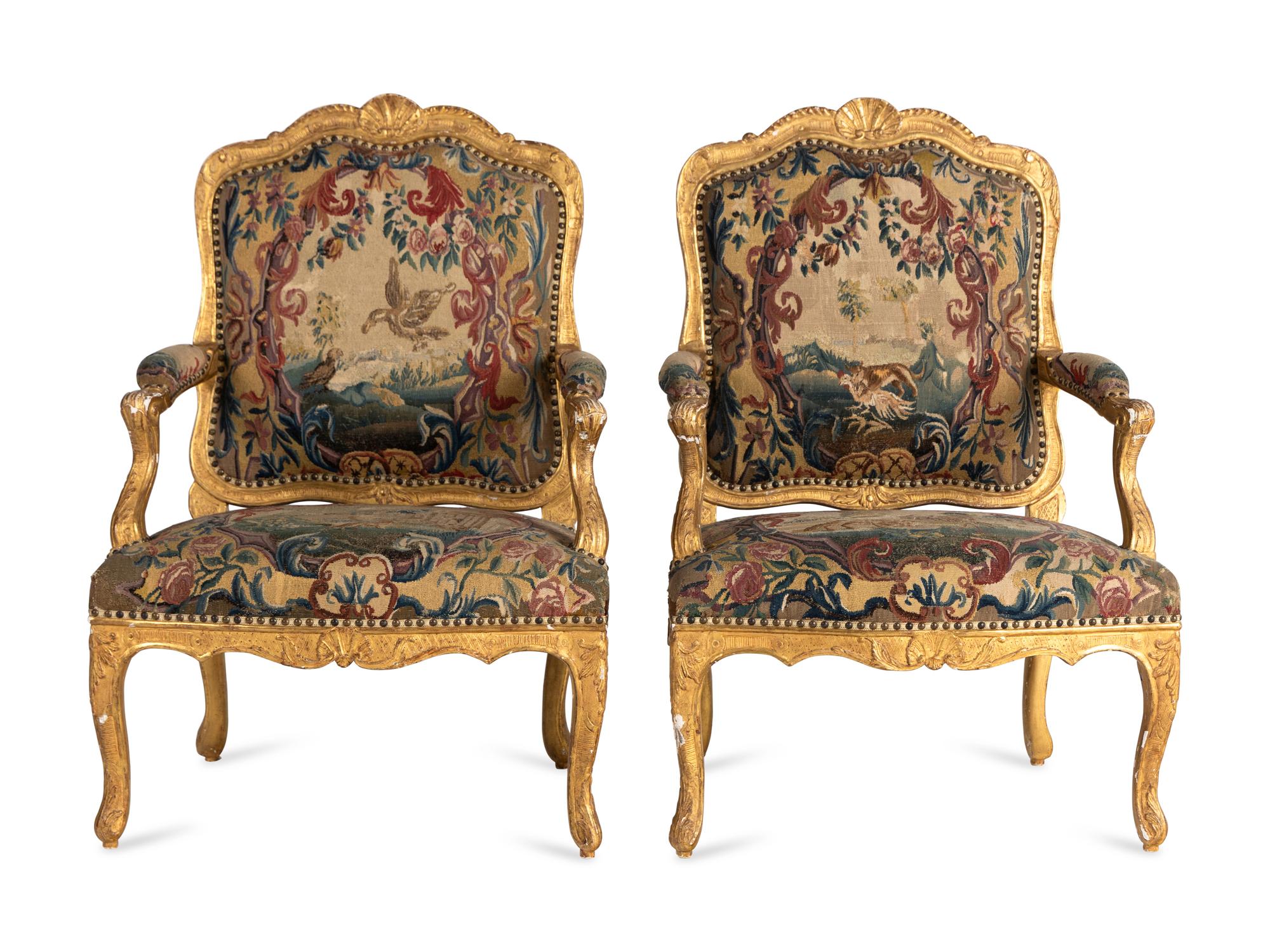 A Pair of Régence Tapestry-Upholstered Giltwood Fauteuils