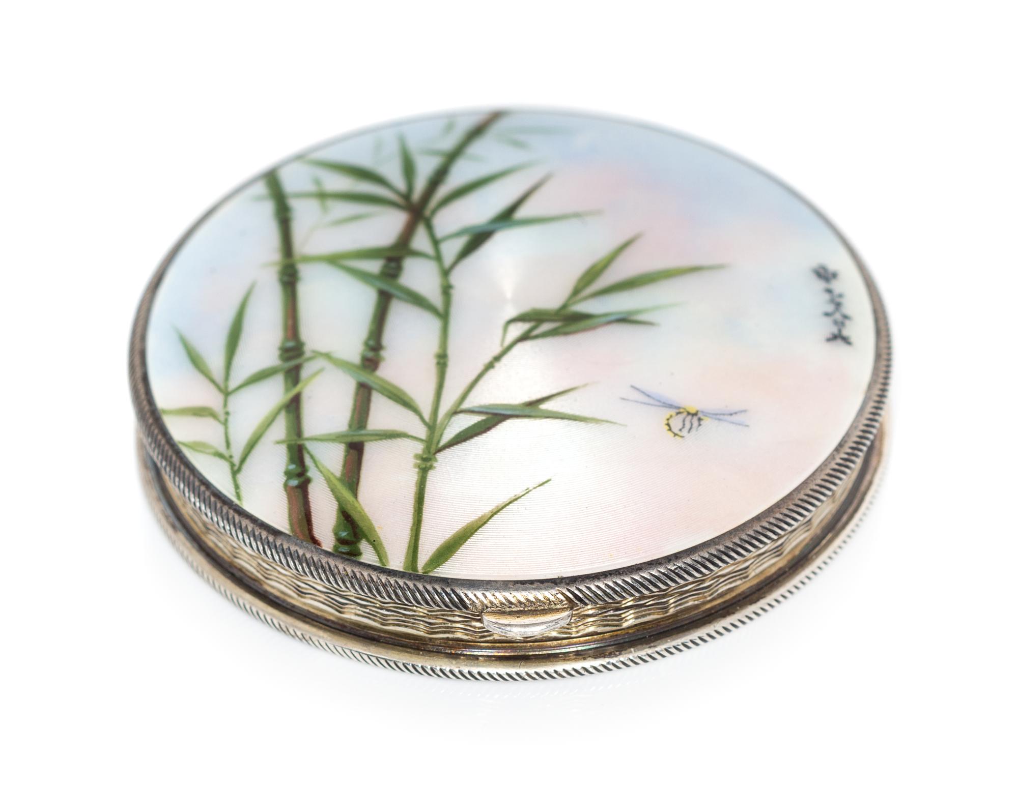 A Continental Silver and Enamel Compact, Import Mark GS, London, 1925, the lid enameled with bamboo shoots, dragonflies and four Chines