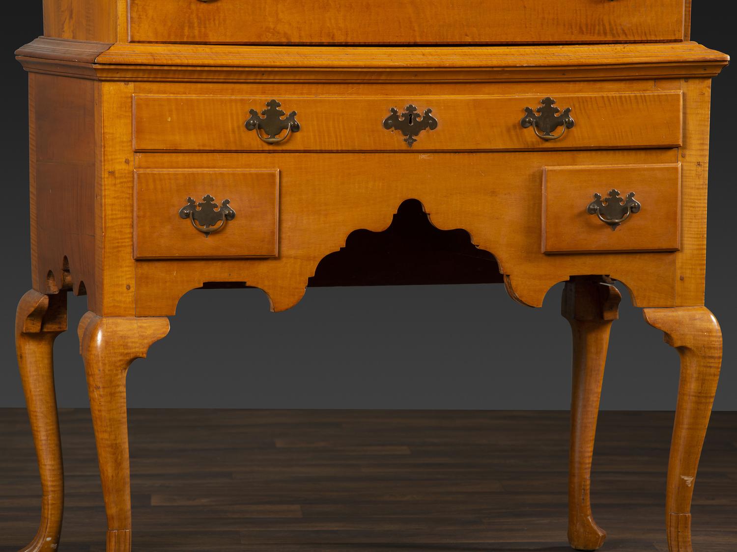 A Queen Anne Fan-Carved Tiger Maple Bonnet-Top Tablet-Foot High Chest