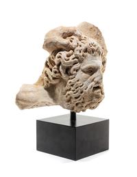 A Roman Marble Bearded Head, Perhaps a Giant, from a Relief