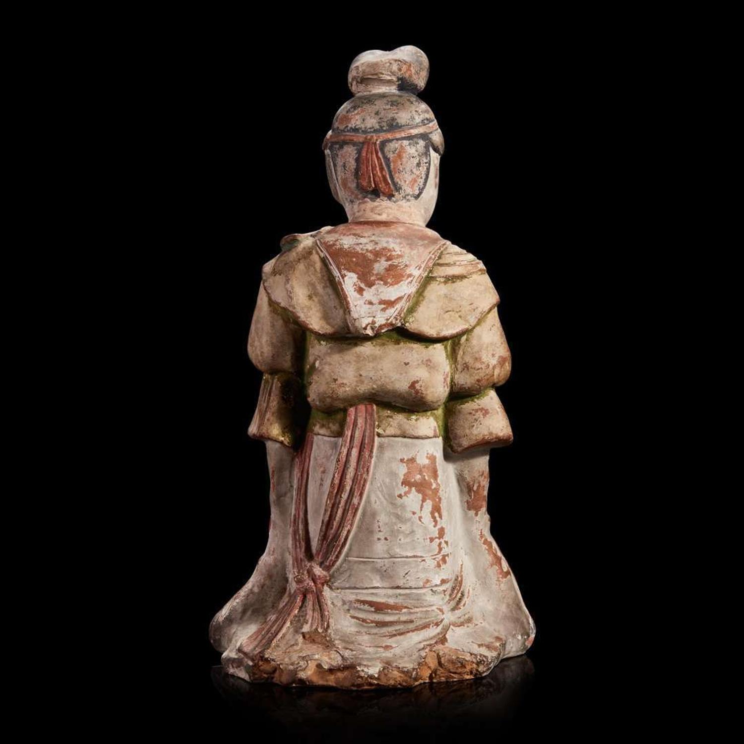 A Japanese painted pottery figure of a female attendant