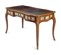 A Louis XV Style Gilt Bronze and Sèvres Style Porcelain Mounted Kingwood Bureau Plat