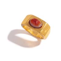 A Roman Gold and Banded Carnelian Cabochon Finger Ring