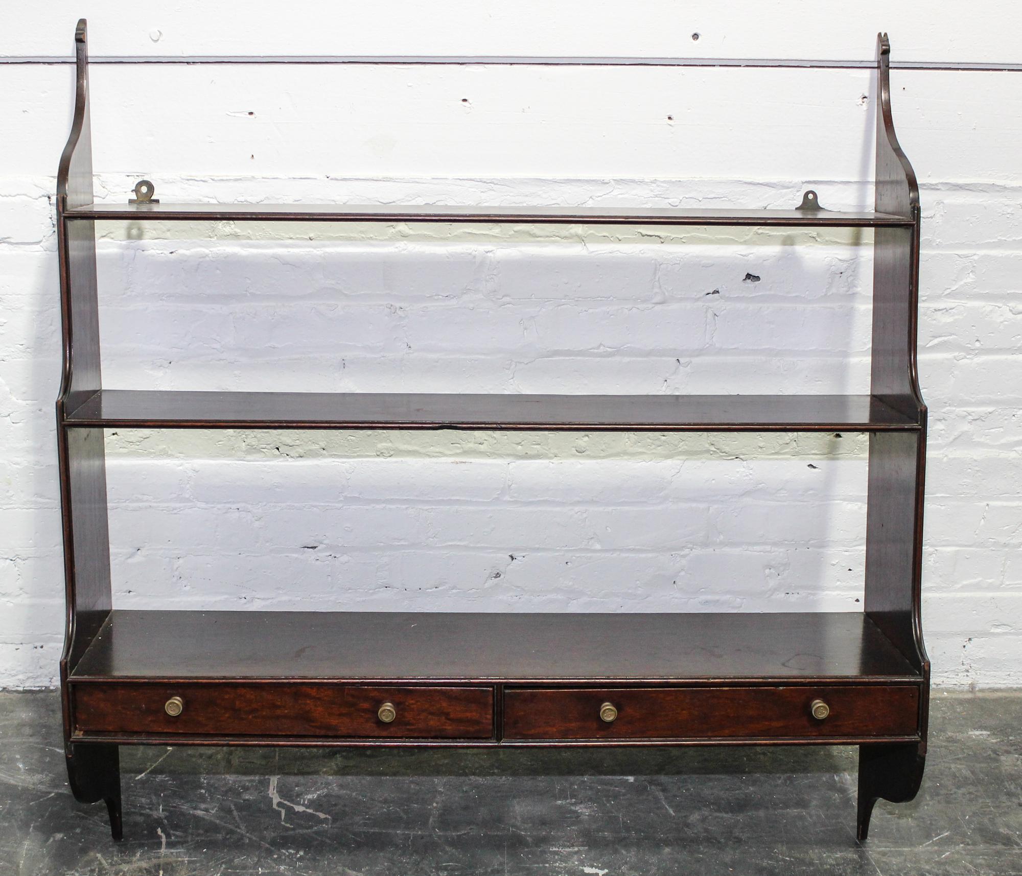 An English Mahogany Hanging Étagère Width 36 inches. — 20TH CENTURY