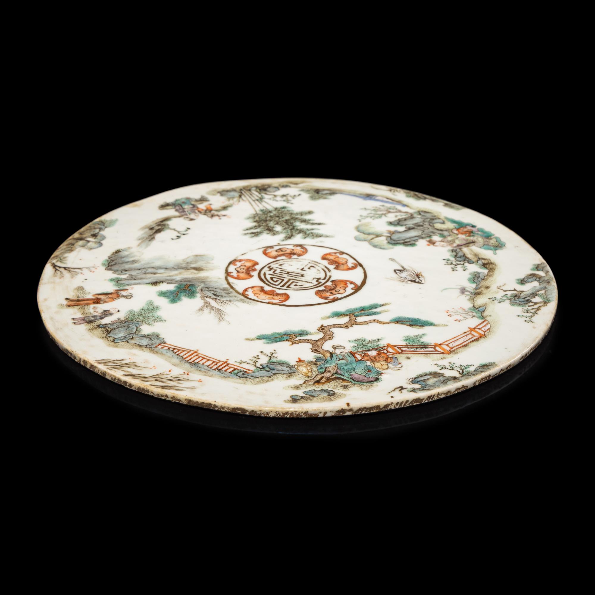 A Chinese Famille Rose Porcelain Circular Plaque, Second Half of 19th Century — 清晚期 粉彩行樂圖圓瓷板