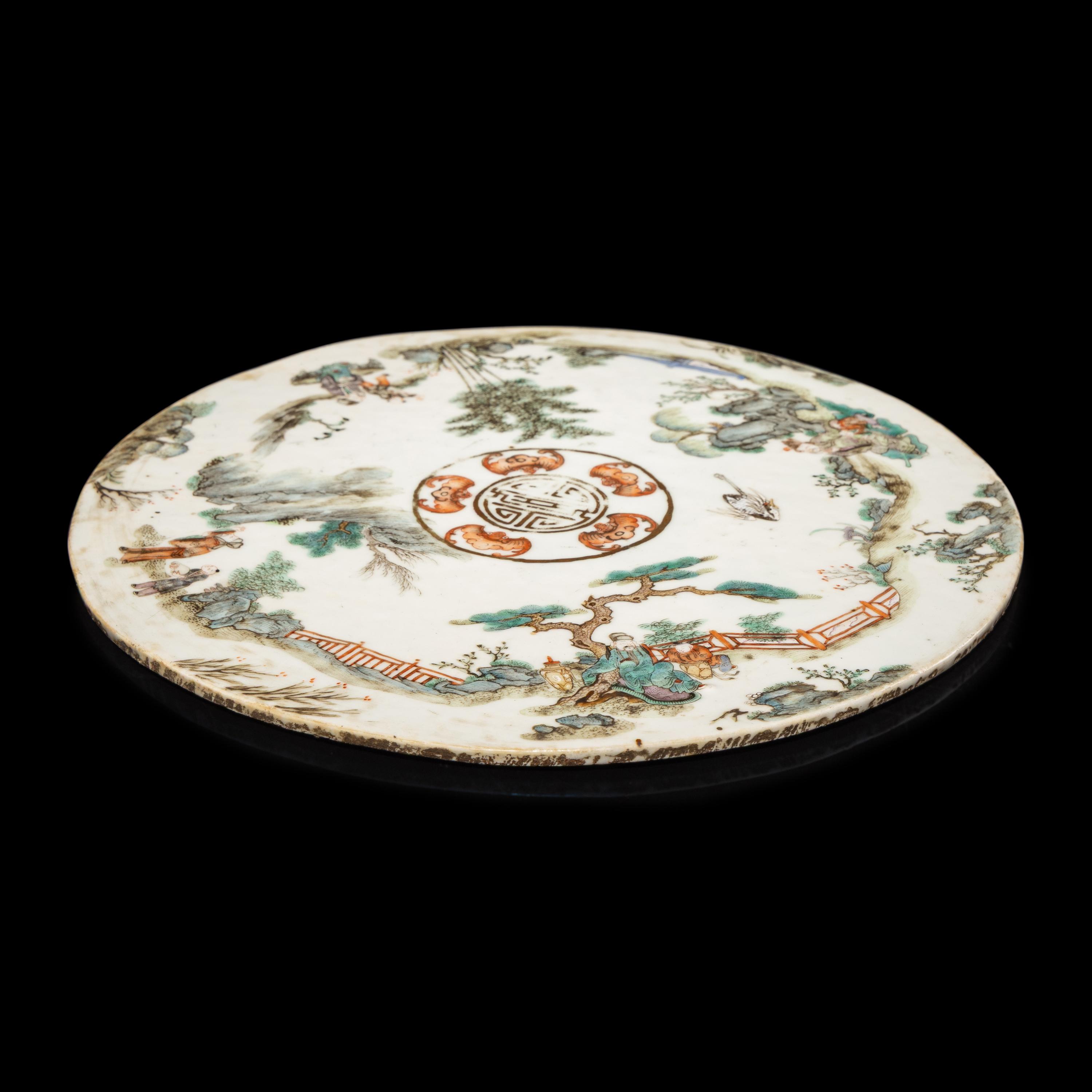 A Chinese Famille Rose Porcelain Circular Plaque, Second Half of 19th Century — 清晚期 粉彩行樂圖圓瓷板