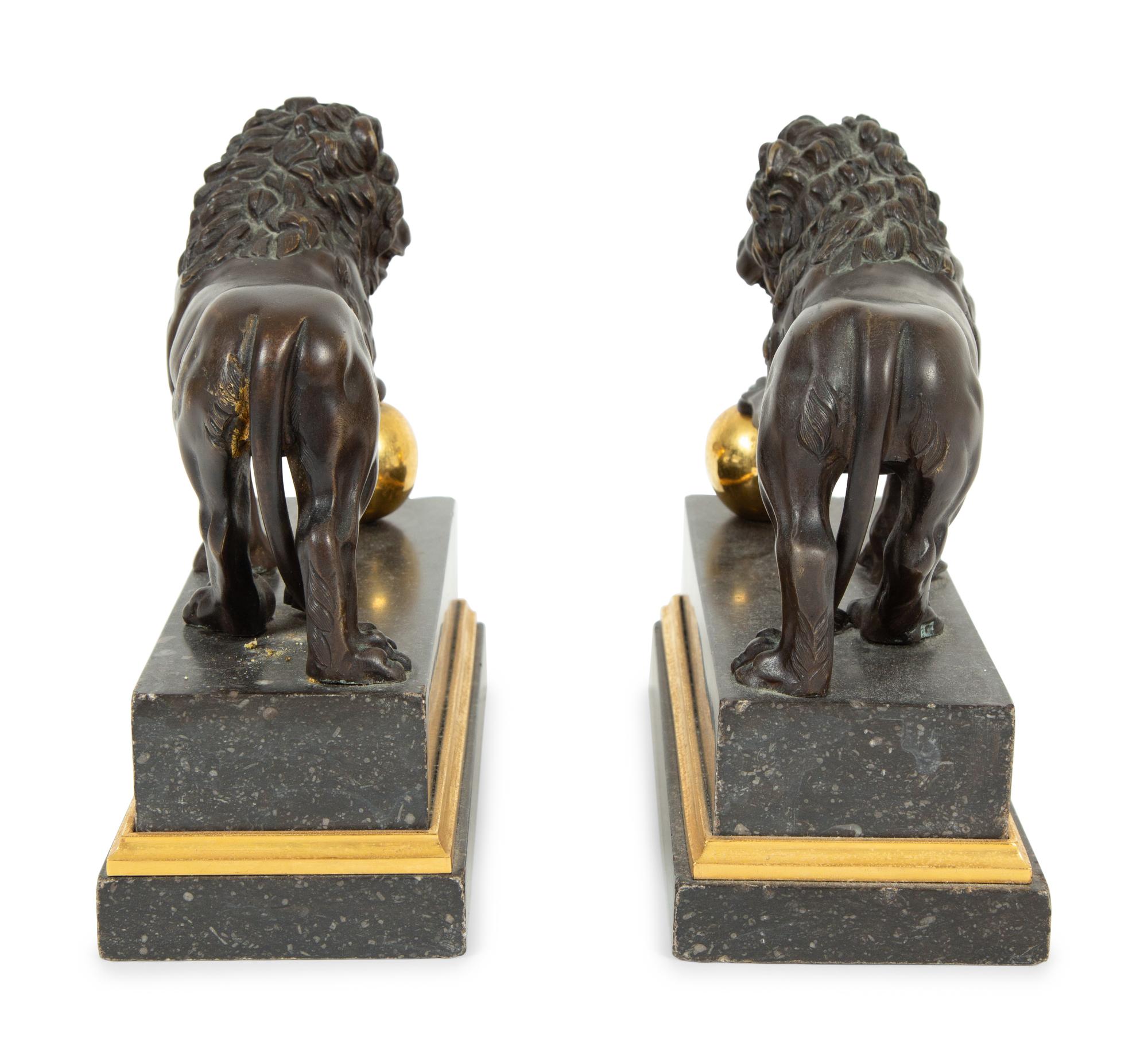 A Pair of Continental Patinated and Gilt Bronze Medici Lions