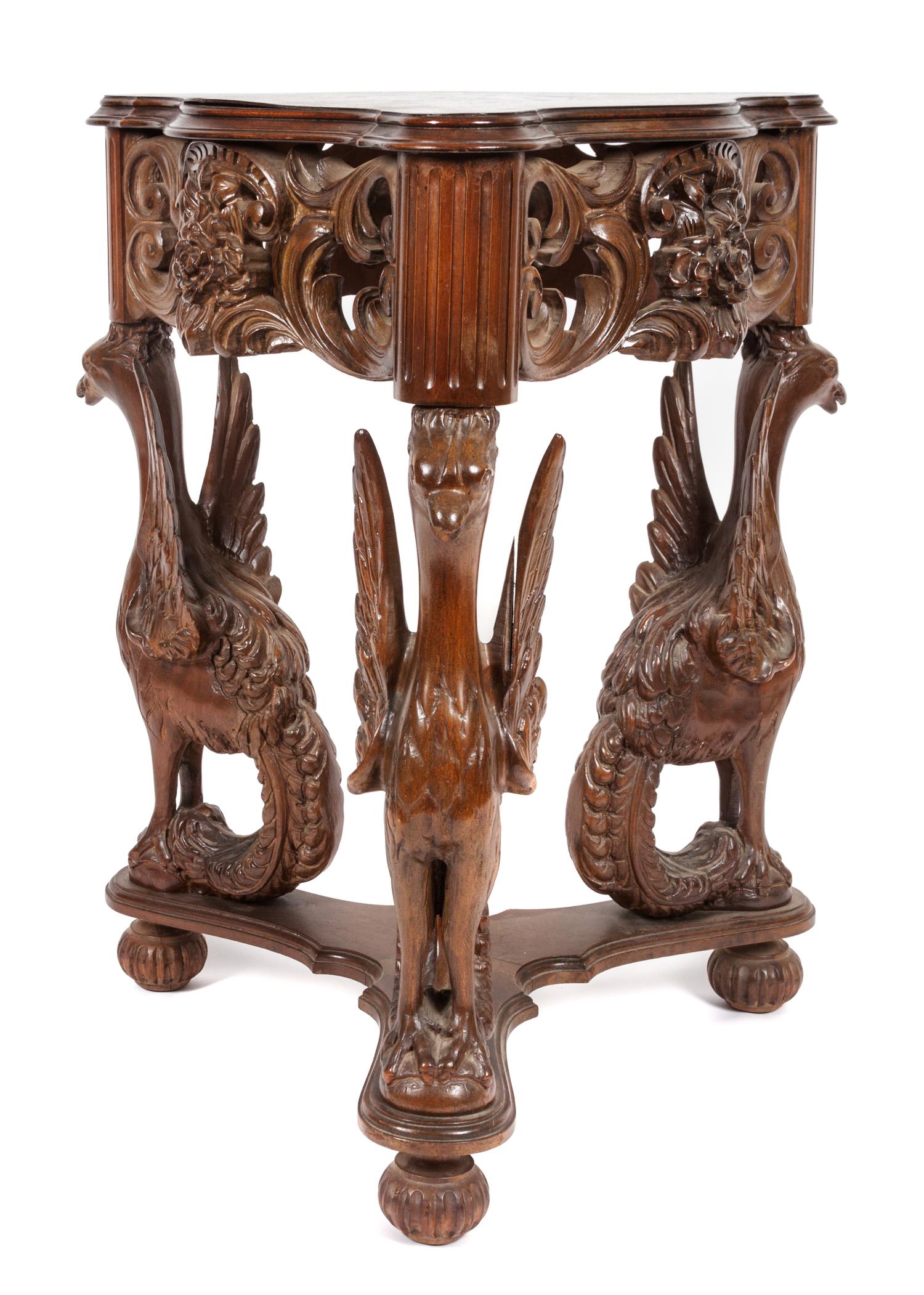 A Victorian Style Carved Walnut Occasional Table Height 28 3/4 x width 23 x depth 23 inches.