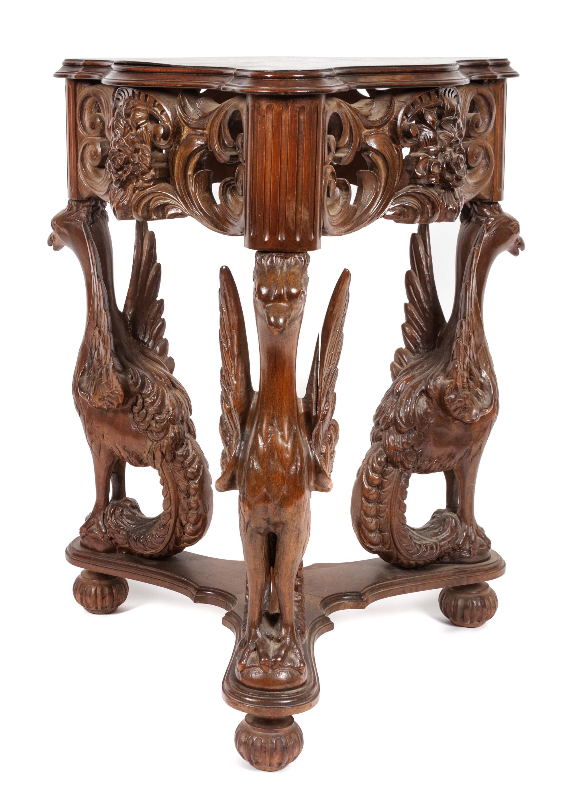 A Victorian Style Carved Walnut Occasional Table Height 28 3/4 x width 23 x depth 23 inches.