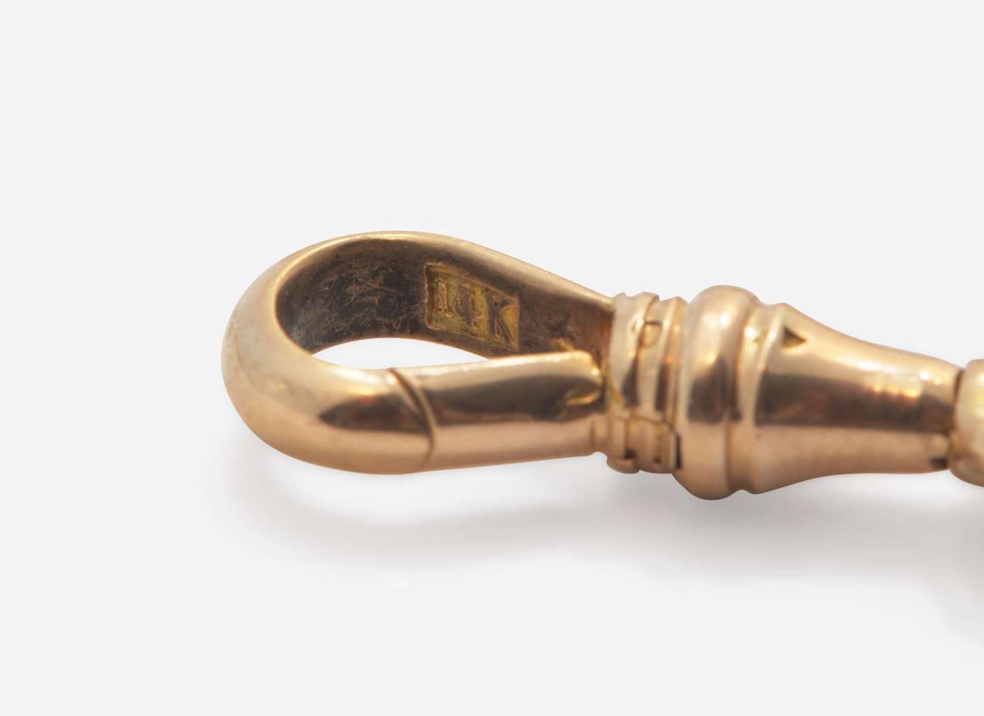 A Long 14K Yellow Gold Pocket Watch Chain