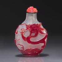 A Chinese Ruby Overlay Glass "Dragon" Snuff Bottle, Qing Dynasty, 18th Century — 清中期 雪霏地套寶石紅料龍戲珠鼻煙壺