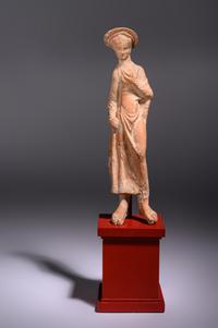 A Greek Terracotta Woman Wearing a Polos (broad-rimmed hat)
