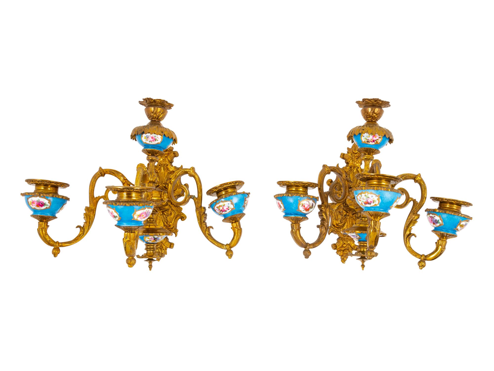 A Pair of Sèvres Style Porcelain and Gilt Bronze Four-Light…