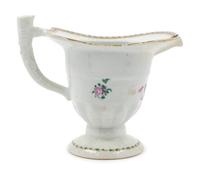A Chinese Export Armorial Porcelain Creamer