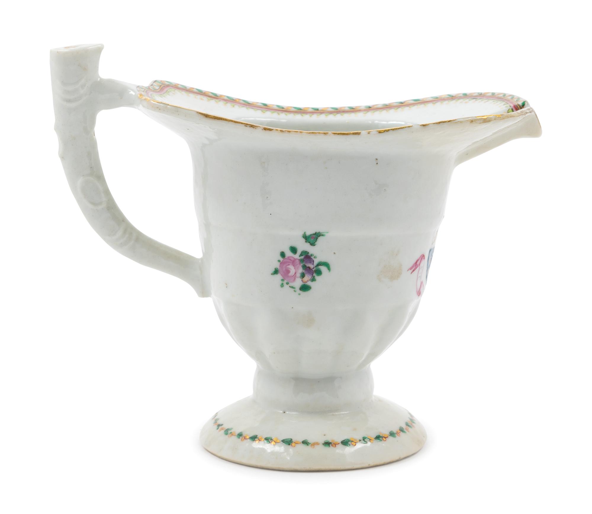 A Chinese Export Armorial Porcelain Creamer