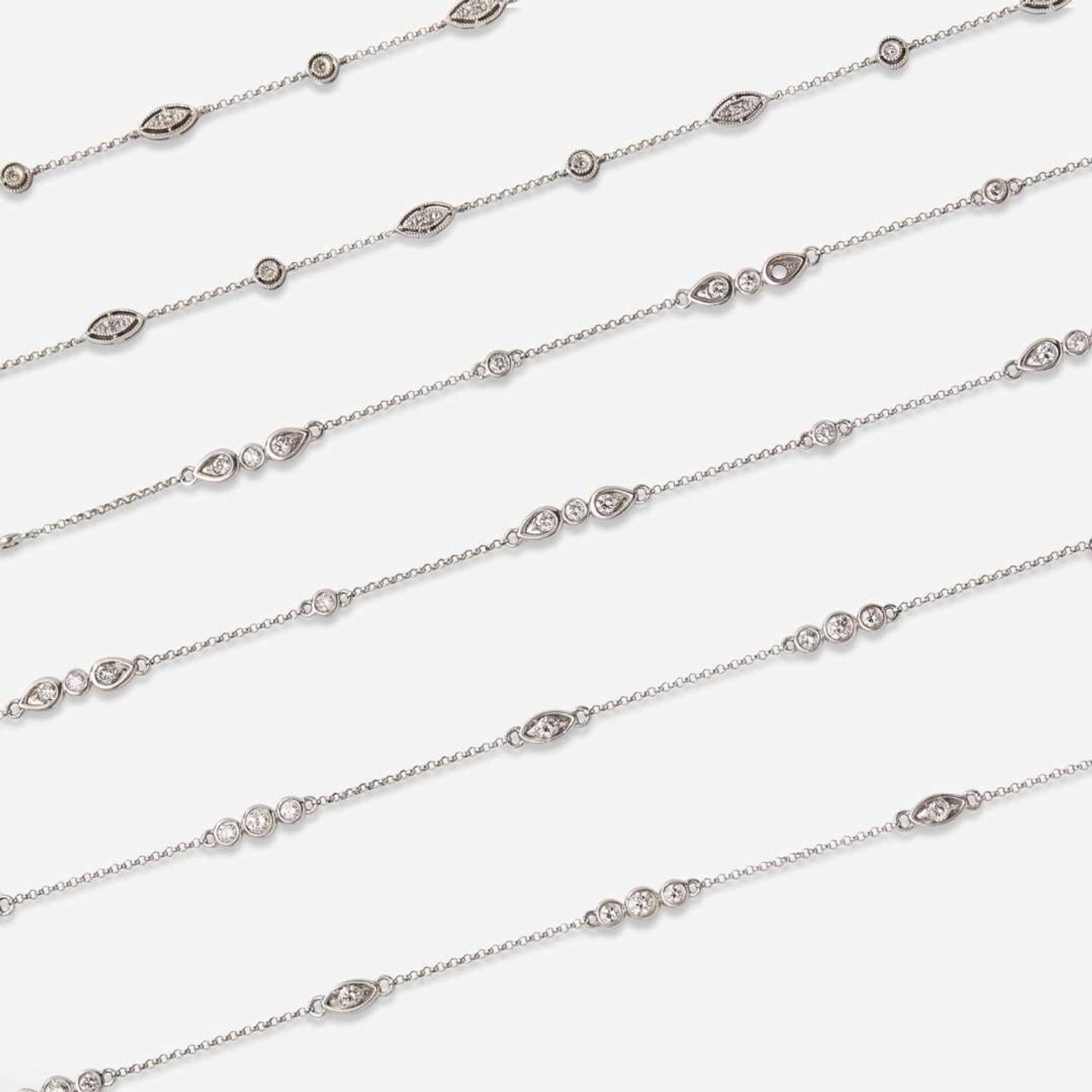 A Set of Three 14K White Gold and Diamond Chains