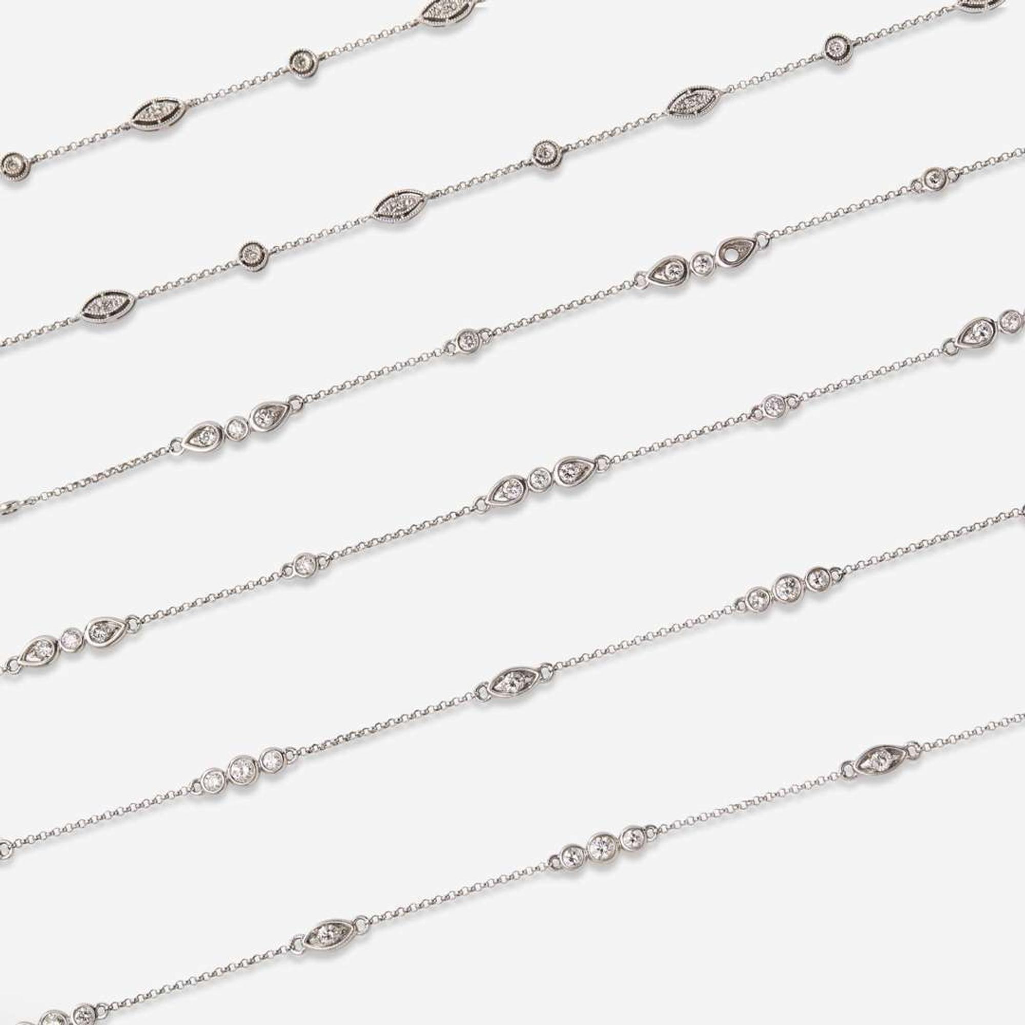 A Set of Three 14K White Gold and Diamond Chains