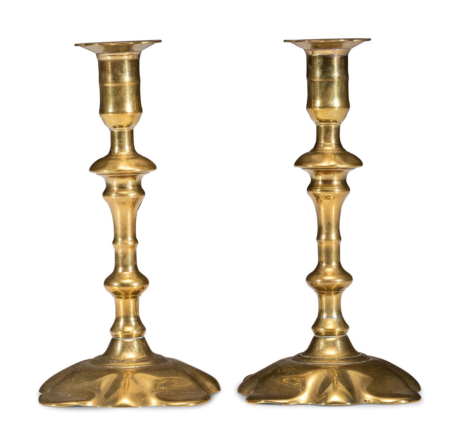 A Pair of Queen Anne Brass Petal Base Candlesticks