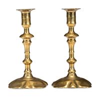 A Pair of Queen Anne Brass Petal Base Candlesticks