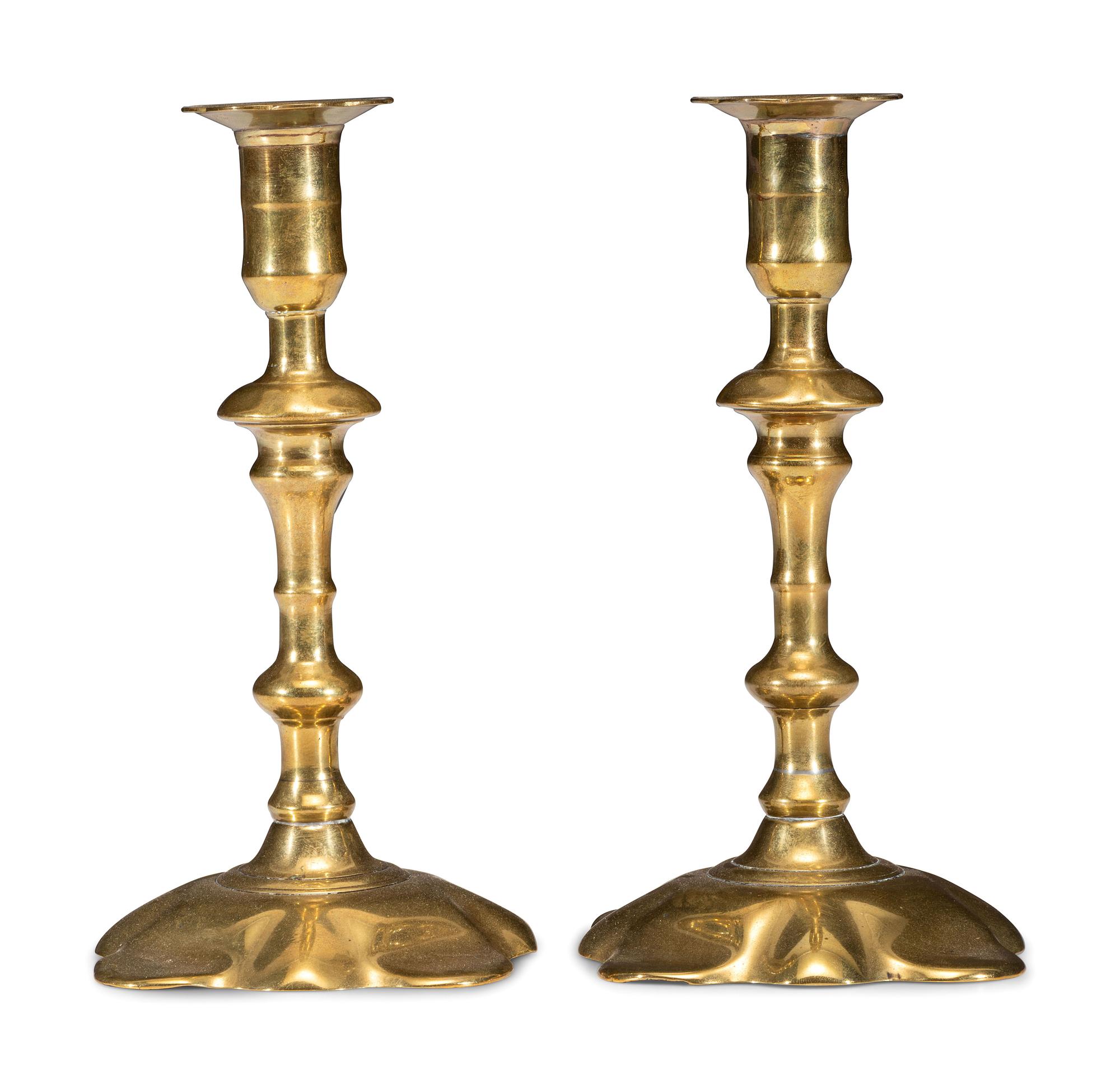 A Pair of Queen Anne Brass Petal Base Candlesticks