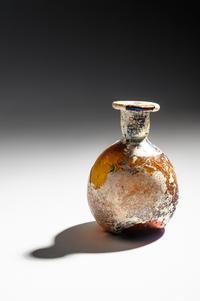 A Roman Amber Glass Flask