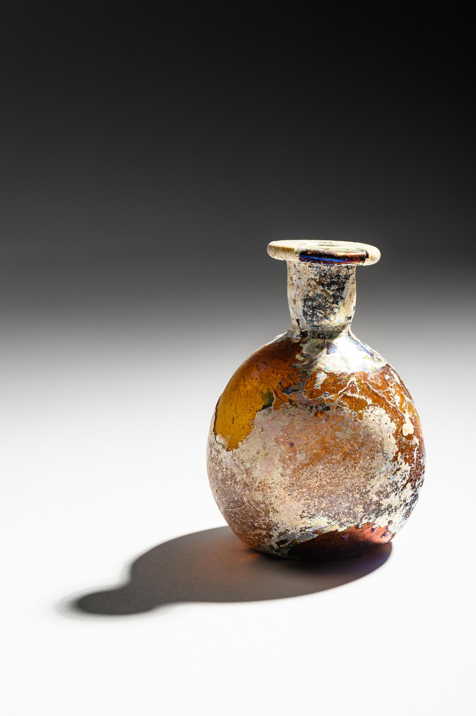 A Roman Amber Glass Flask