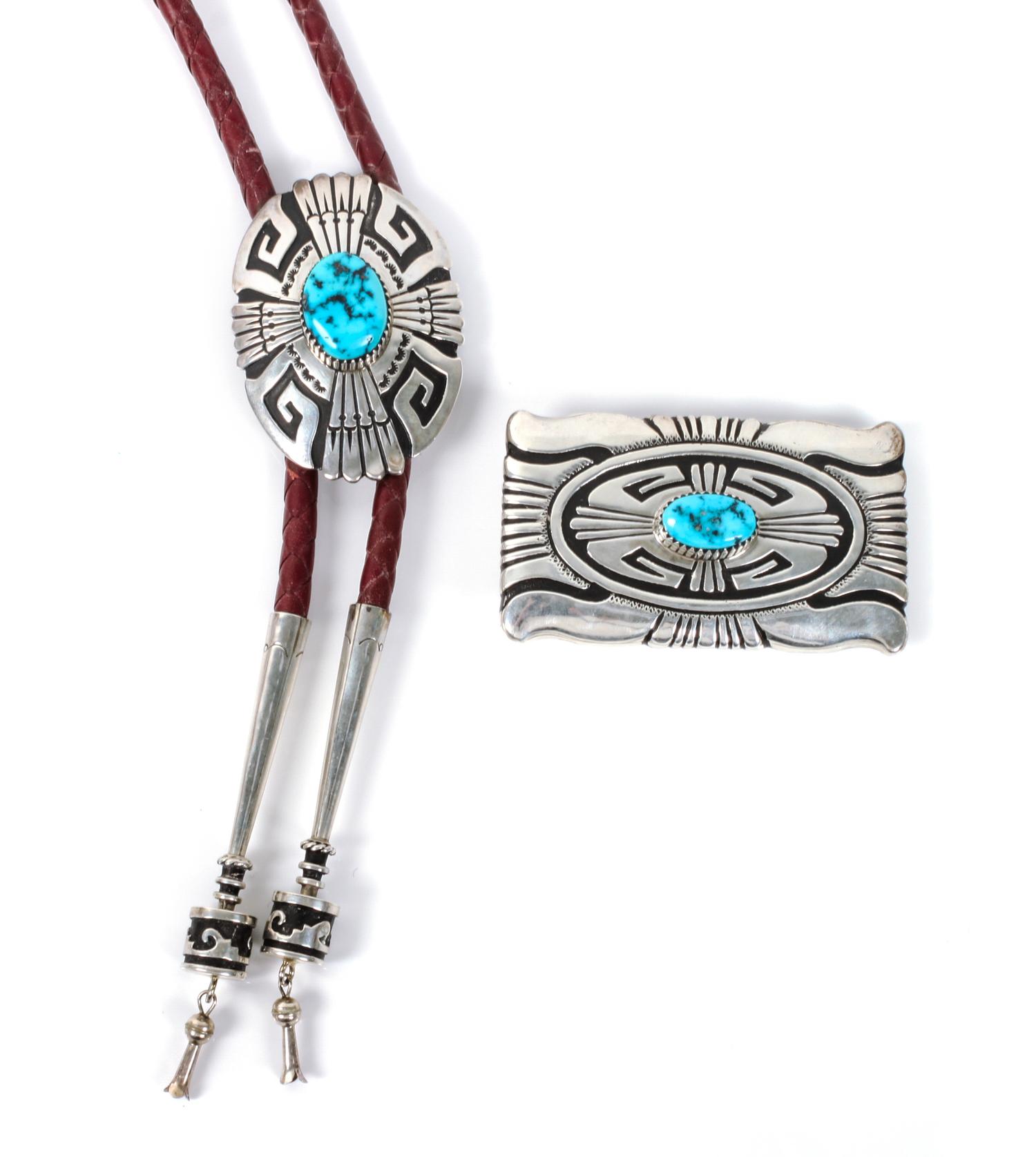 A Navajo Silver and Turquoise Belt Buckle and Matching Bolo, Thomas Singer Height of buckle 2 x width 3 1/2 inches.