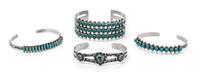 A Collection of Silver and Turquoise Cuff Bracelets,