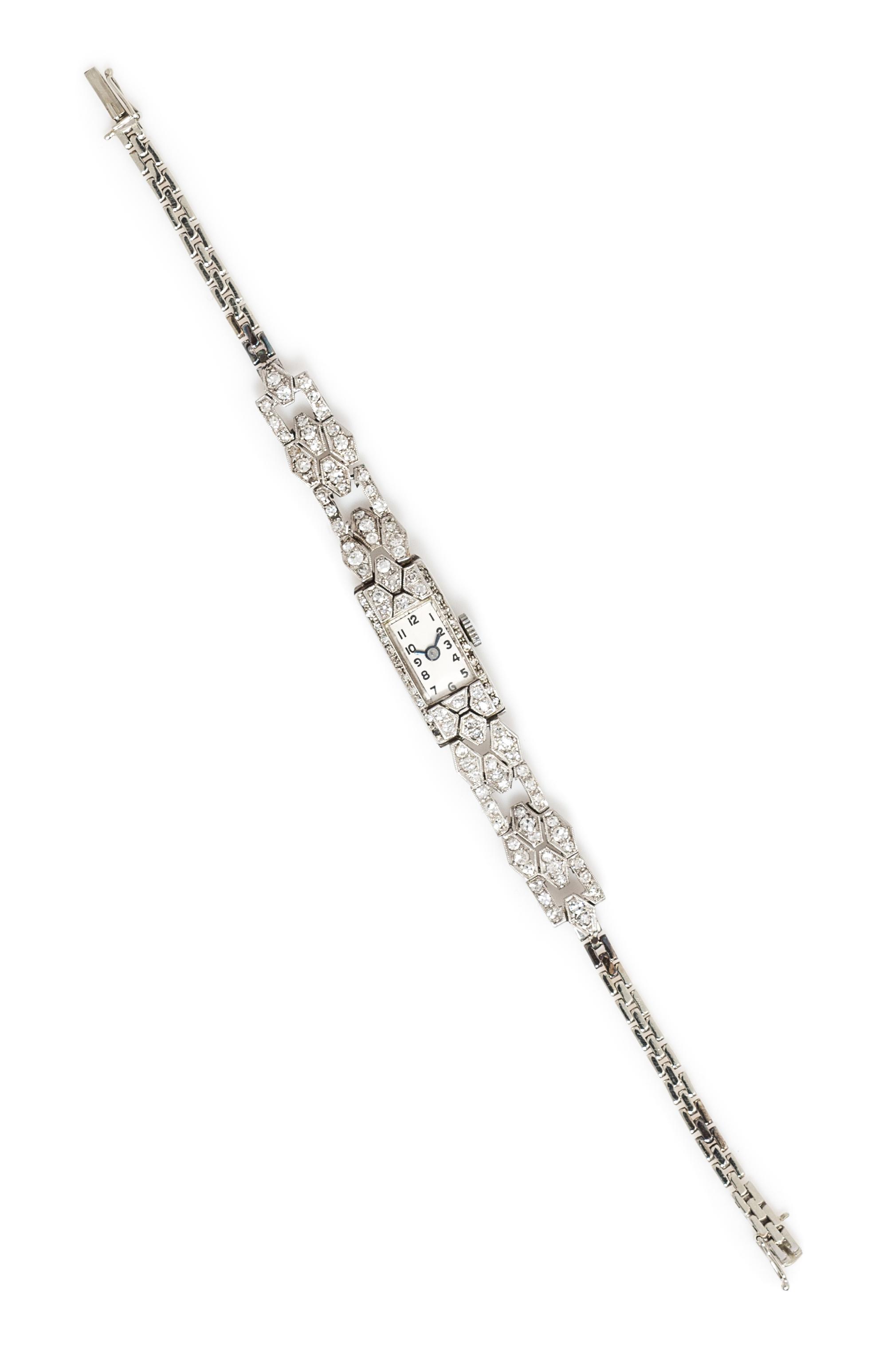 A Platinum, 18 Karat White Gold and Diamond Wristwatch, 10.00 dwts.