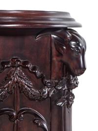 A Pair of George III Style Carved Mahogany Pedestals
