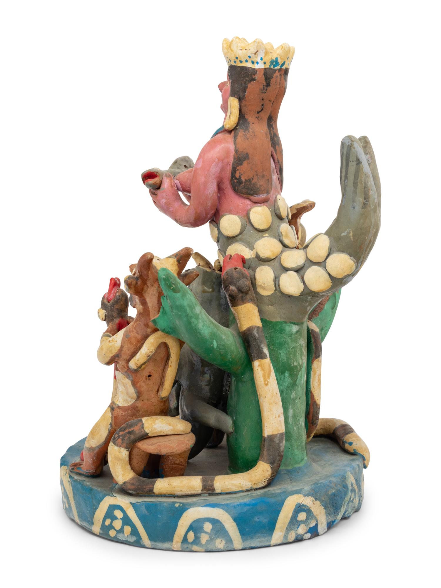 A Mexican Folk Art Polychrome Decorated Figural Group