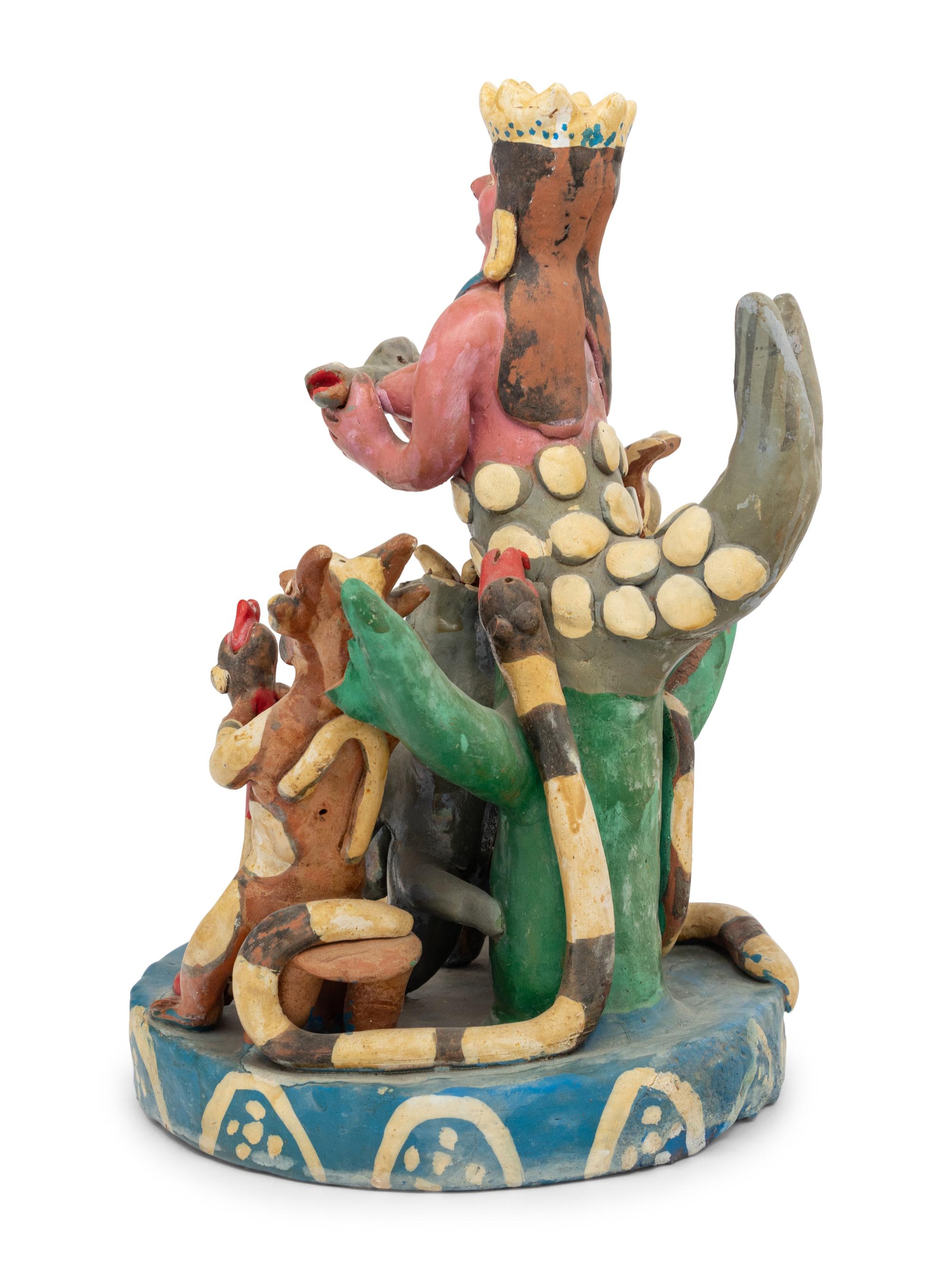 A Mexican Folk Art Polychrome Decorated Figural Group