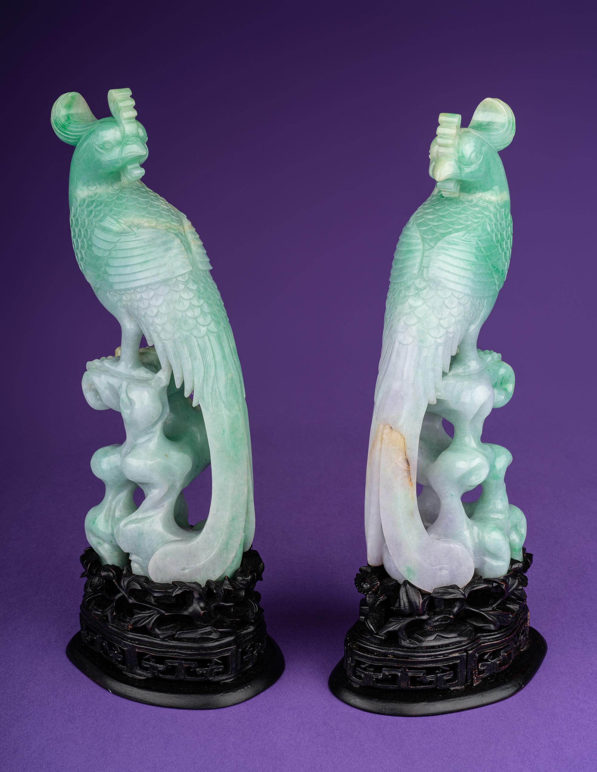 A Pair of Semi-Translucent Green Jadeite Figures of Phoenix