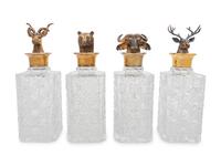A Set of Four English Silver Mounted Cut-Glass Decanters