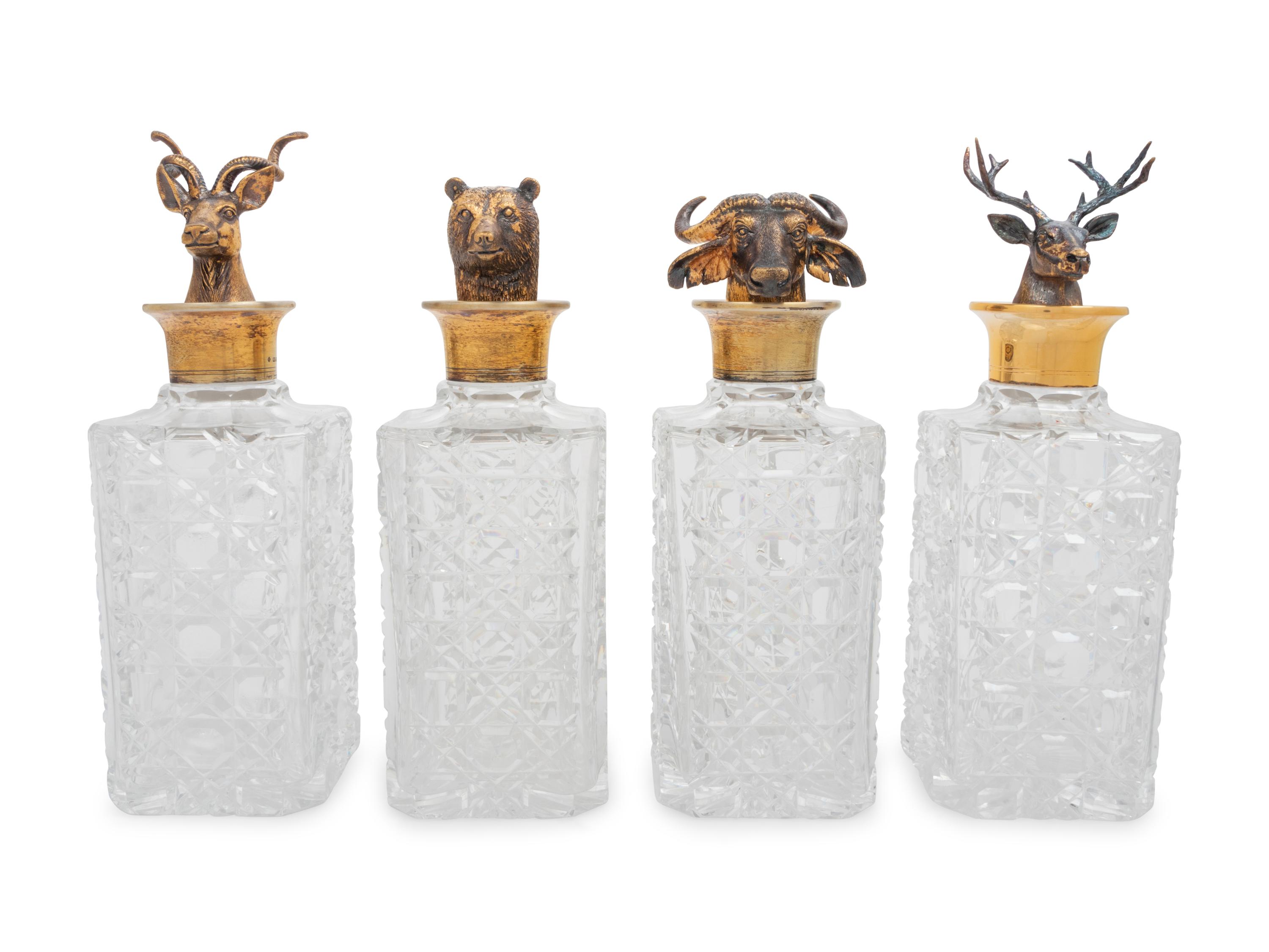 A Set of Four English Silver Mounted Cut-Glass Decanters
