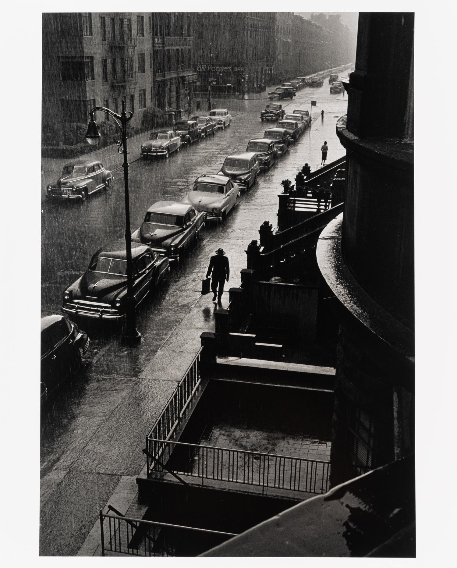 Ruth Orkin (1921-1985) Man in Rain, West 88th Street, New York City, 1952