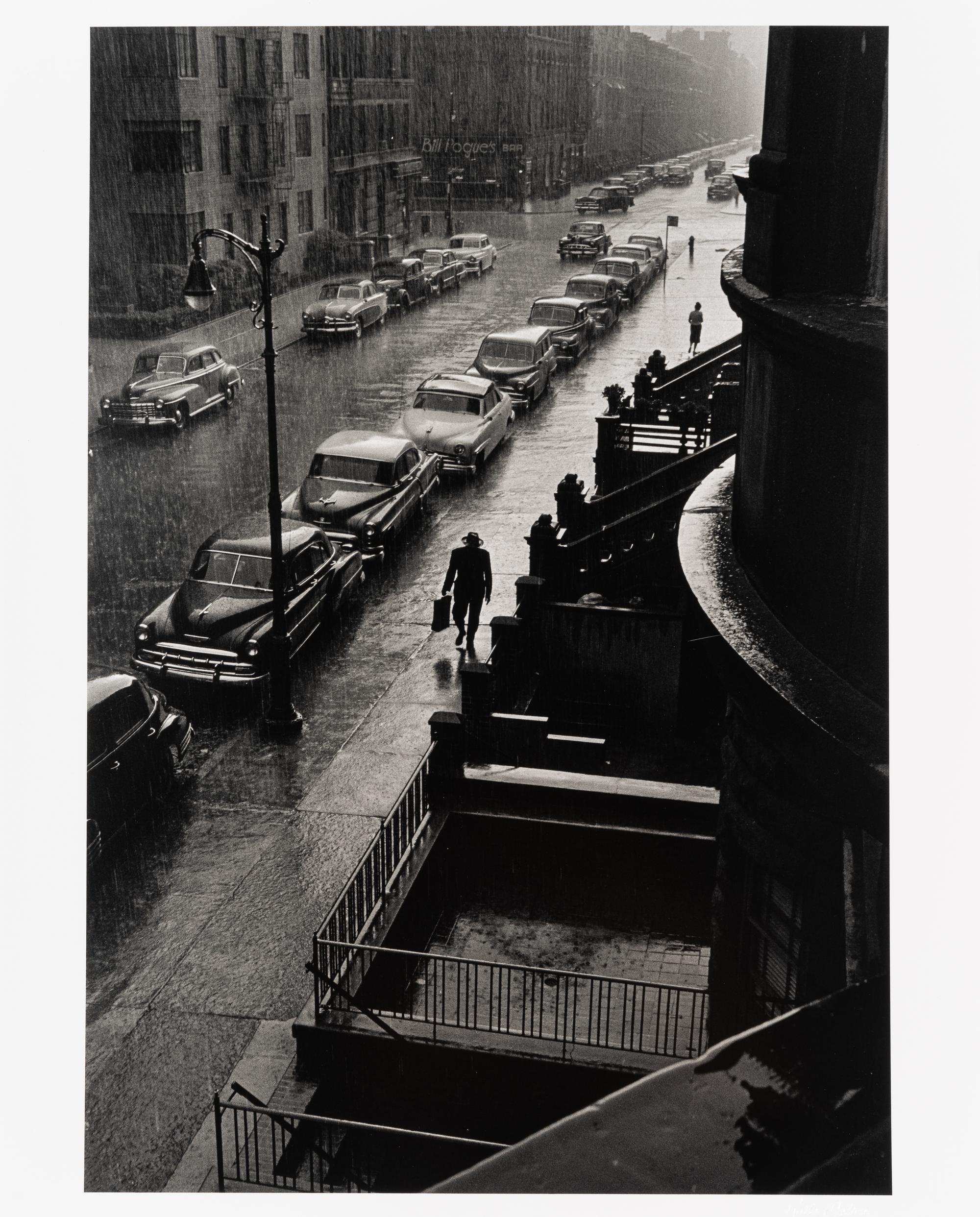 Ruth Orkin (1921-1985) Man in Rain, West 88th Street, New York City, 1952