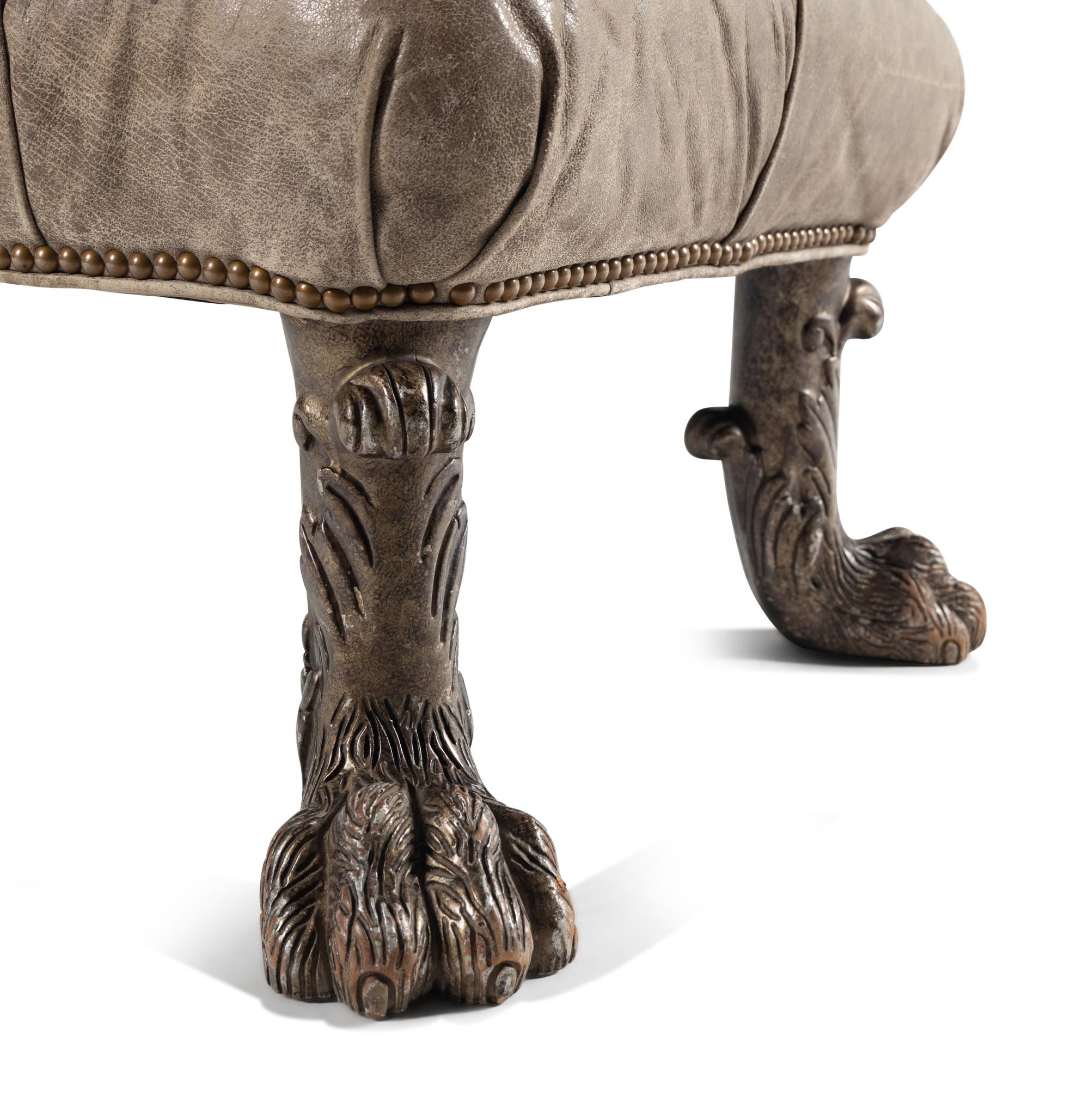 A Leather Upholstered Ottoman